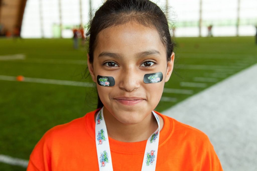 Latino girl in eye black close up