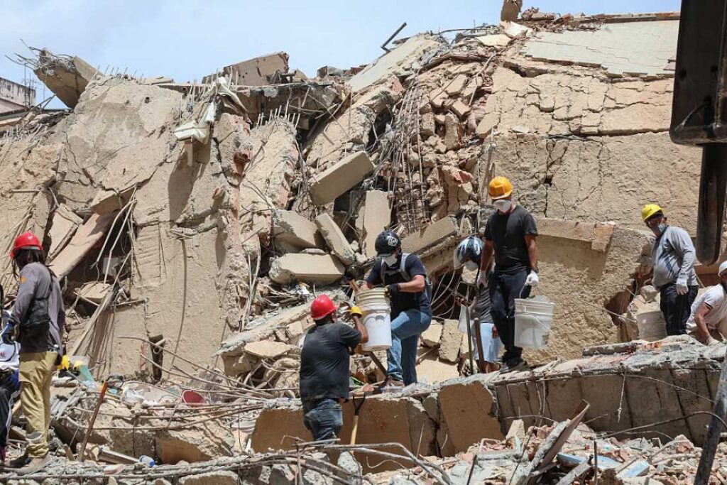 Rescuers working among the rubble of a collapsed building in Caracas following the earthquakes of June 2026