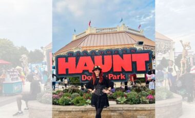 Visitors walking through the spooky entrance gate at Dorney Park Halloween Haunt surrounded by fog, scare actors, and themed attractions.